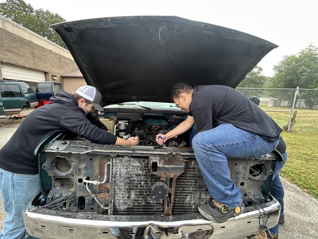 Students working on engine