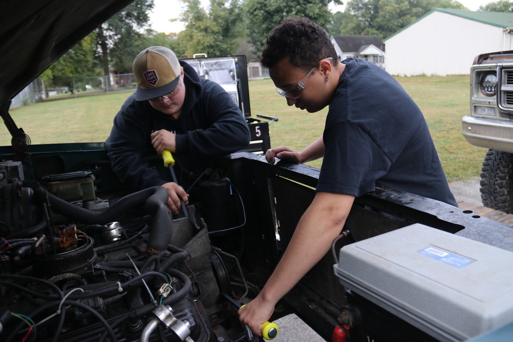 Students working on engine
