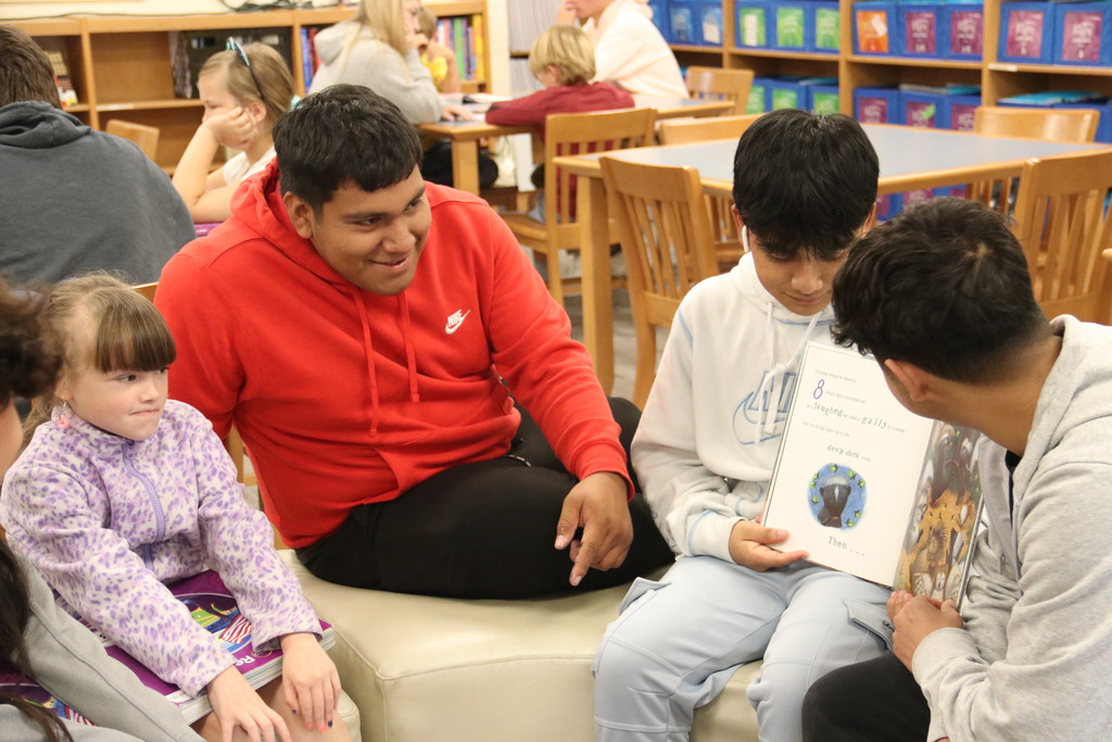 High schoolers read to students