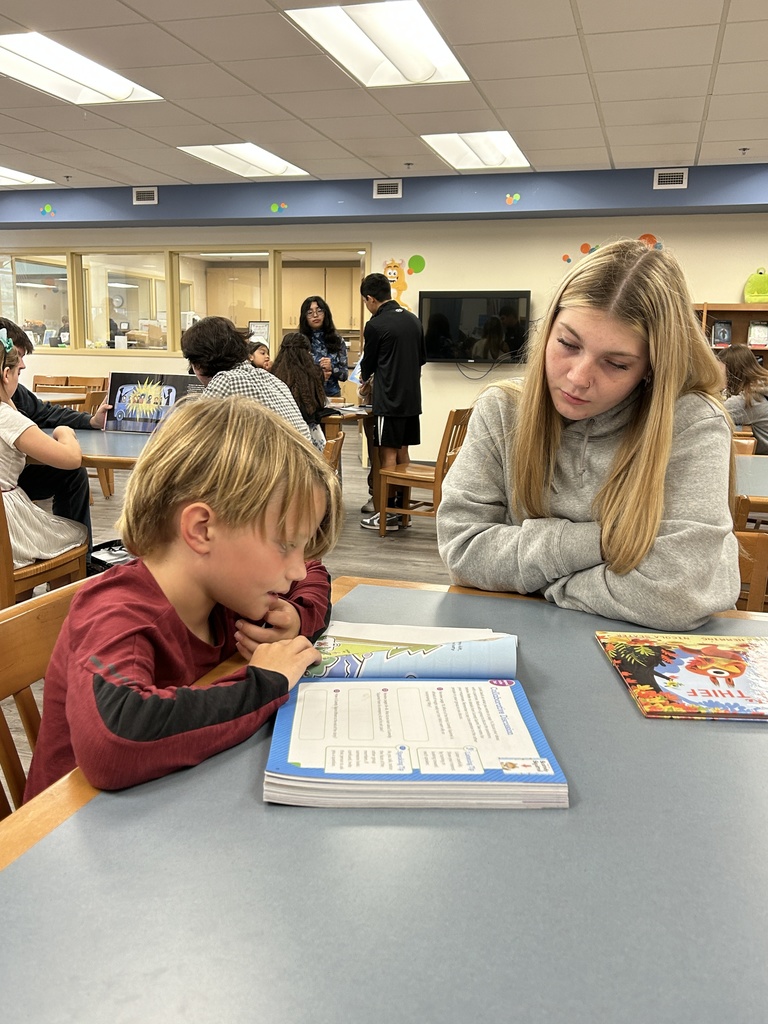High schoolers read to students
